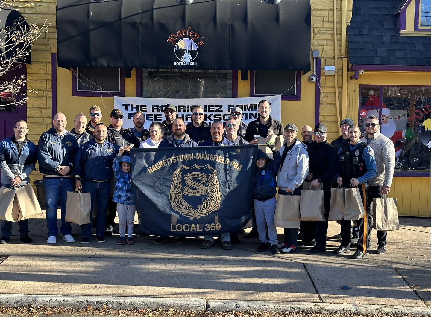 Hackettstown and Mansfield police hand out Thanksgiving meals to